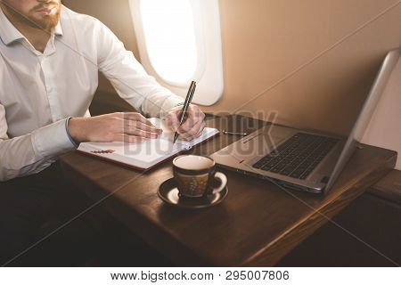 Attractive And Successful Businessman In A White Shirtt Working Sitting In The Chair Of His Private 