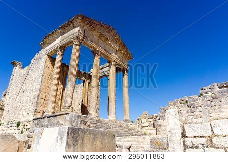 Ruins Of The Capitol Temple In The Ancient Roman Ruins Of Dougga, Tunisia.