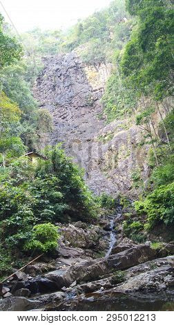Kedah, Langkawi, Malaysia - Apr 10th, 2015: The Temurun Waterfall - Forest Park Featuring A 3-tier W