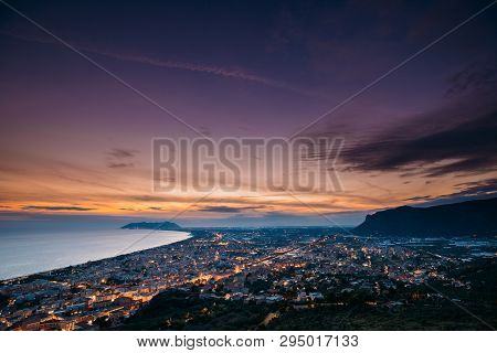 Terracina, Italy. Top View Skyline Cityscape City In Evening Sunset. City Illuminations.