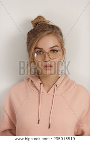 Hipster Young Girl Over Wall. Portrait Of Woman Confuse And Wonder About Question. Uncertain With Do