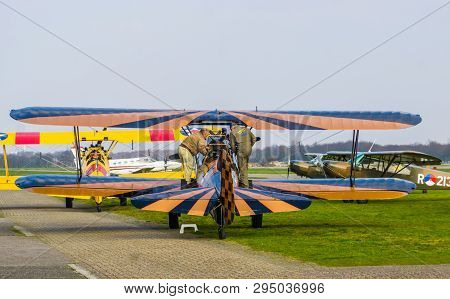 Two Men Preparing The Flight Of A Stunt Airplane At Airport Seppe Breda, Bosschenhoofd, The Netherla