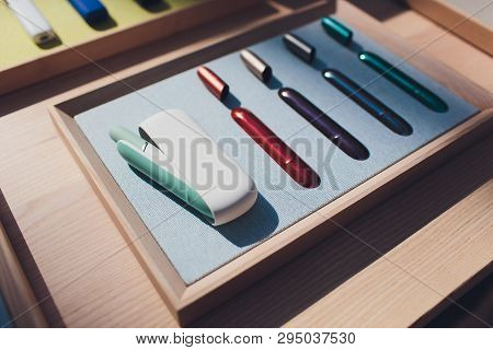 New Design Iqos. Showcase With A Large Multi-colored Selection System Of Heating Of Tobacco. Color D