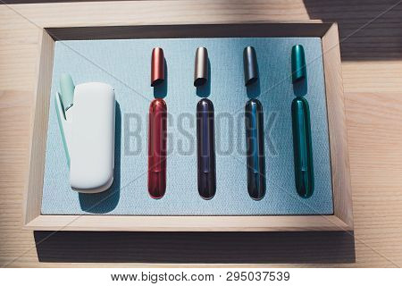 New Design Iqos. Showcase With A Large Multi-colored Selection System Of Heating Of Tobacco. Color D
