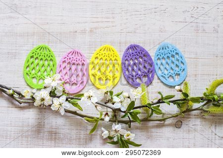 Easter Eggs Made Of Colored Felt With Flowering Branches Of Fruit Tree. Postcard, Banner For Easter.