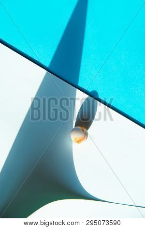 Artistic background with a glass marble with intrasting shadows. 