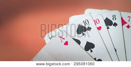 Playing Cards: Poker Cards In The Hand Of A Man