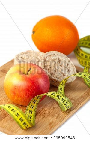 Apple, Orange, Kiwi With Measure Tape On White Background