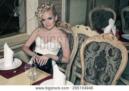 Beautiful Woman Waiting For Dinner In Restaurant