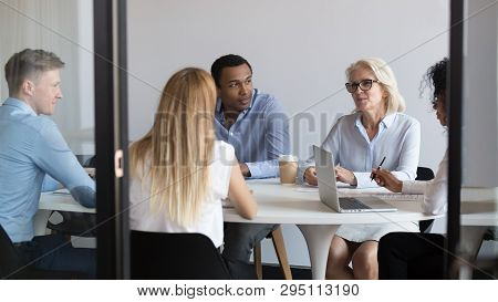 International Negotiators Or Diverse Office Staff Talking Negotiating In Boardroom
