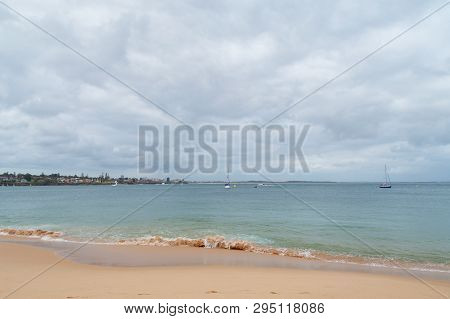 Sandy Ocean Beach With Soft Waves And Yachts In The Lagoon. Summer Holiday At Jibbon Beach, Autralia