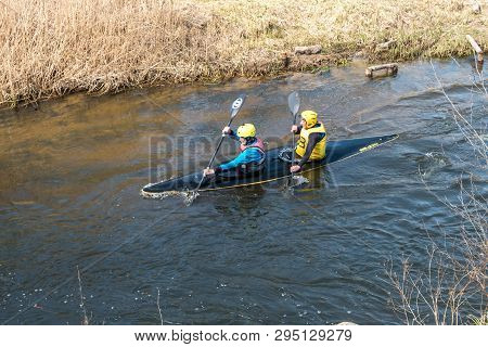 Grodno, Belarus - April, 2019: Kayak Freestyle Competition On Fast Cold Water River Strenuously Rowi