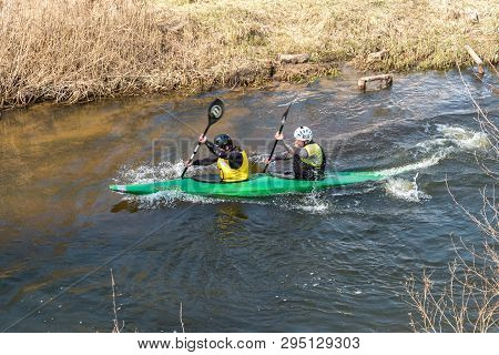 Grodno, Belarus - April, 2019: Kayak Freestyle Competition On Fast Cold Water River Strenuously Rowi