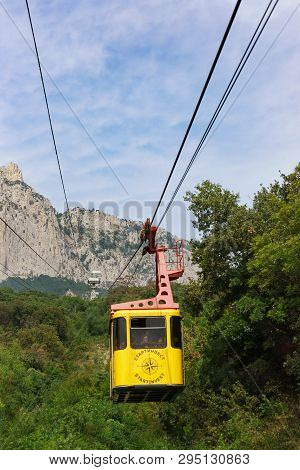 Mishor, Yalta, Crimea, Russia - September 14, 2018: Cableway With Tourists Rises To The Top Of Ai-pe