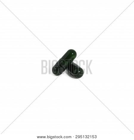 Green Pills Isolated On White Background. Multivitamin Supplements Capsules For Health.
