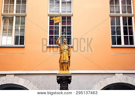 Riga, Latvia - August 29, 2018: The Golden Knight Is Located In The Courtyard Between Valnu And Maza
