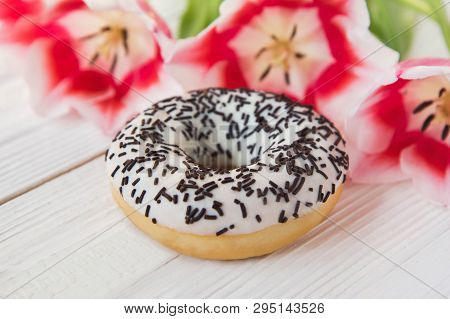 Donut On A White Background With Flowers