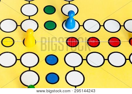 Moscow, Russia - April 2, 2019: Pawns In Marsch Raus ! Board Game Close Up. This Board Game Is Cross