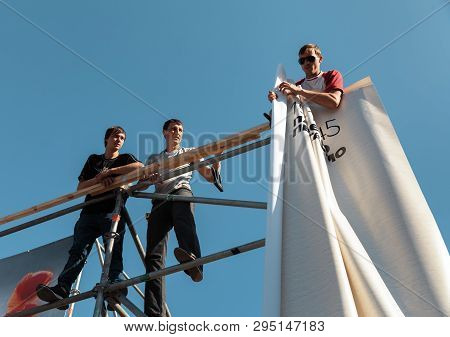 Kyiv, Ukraine - May 04, 2017: Worker Prepares Billboard To Installing New Advertisement On The Indep
