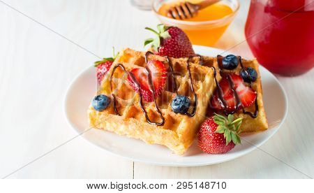Photo Of Fresh Homemade Food Made Of Berry Belgian Waffles With Honey, Chocolate, Strawberry, Bluebe