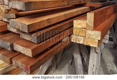 Wood background. Wood texture. Pine ends. Background ends of the boards. The ends of the lumber.