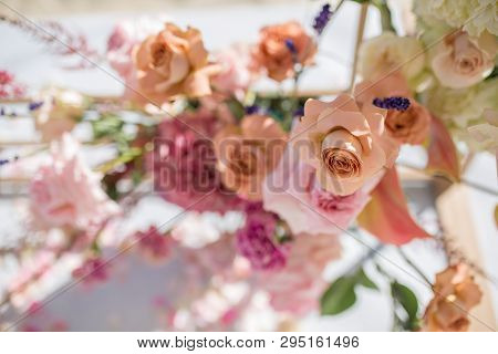 Event Decoration. Wedding Chuppa At Riverside Decorated With Fresh Flowers. Florist Workflow.