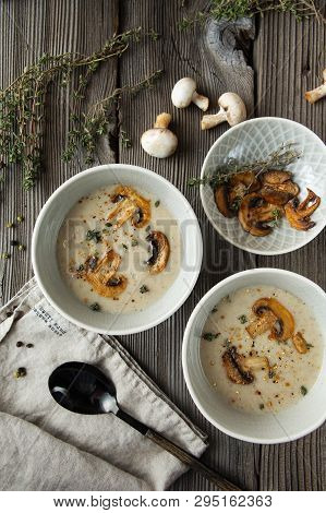 Two Bowls With Delicious Mushroom Soup On Wooden Table. Flat Lay Composition. Food Photography