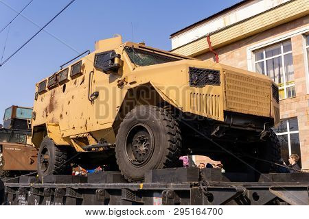 Perm, Russia - April 10, 1019: Armored Car Of Isis Militants With Holes In Armor, Seized As A Trophy