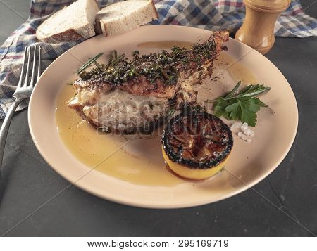 Roasted Sea Bass With Beurre Noir Sauce And Caramelized Lemon