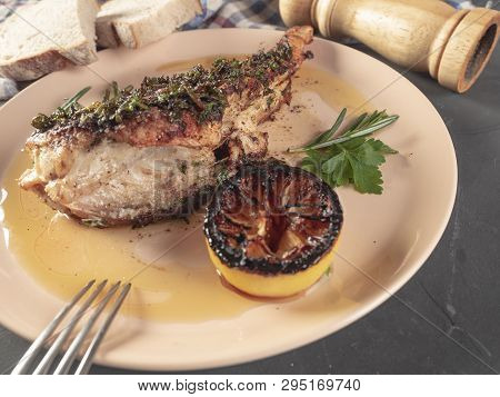 Roasted Sea Bass With Beurre Noir Sauce And Caramelized Lemon