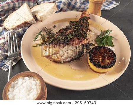 Roasted Sea Bass With Beurre Noir Sauce And Caramelized Lemon