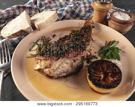 Roasted Sea Bass With Beurre Noir Sauce And Caramelized Lemon