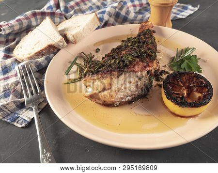 Roasted Sea Bass With Beurre Noir Sauce And Caramelized Lemon