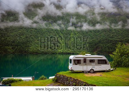 Family vacation travel RV, holiday trip in motorhome, Caravan car Vacation. Beautiful Nature Norway natural landscape.
