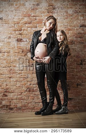 Family in leather clothes on brick wall background (HDR ver)