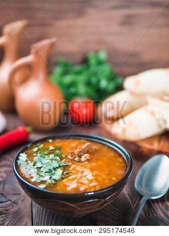 Traditional Georgian Kitchen-soup Kharcho With Meat, Rice And Fresh Cilantro.spicy Soup Kharcho On W