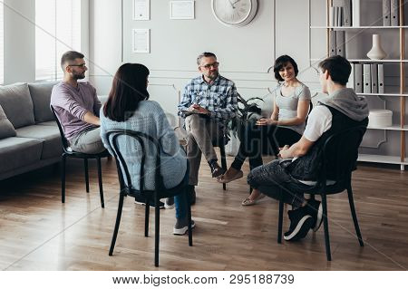 Group Therapy Session For Young Men And Women