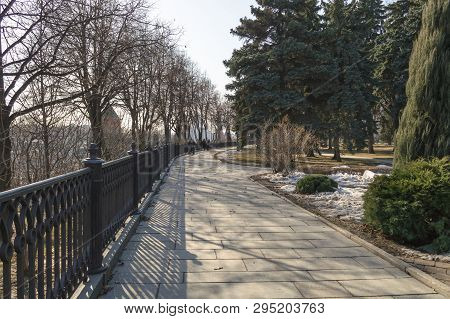 Moscow, Russia, March 10, 2017: Paved Path With Iron Fence And Garden On Kremlin Grounds
