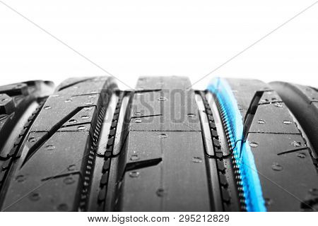 Studio Shot Of A Set Of Summer Car Tire On Black Background. Tire Stack Background. Car Tyre Protect