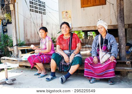 CHIANG RAI, THAILAND- FEBRUARY 2019 : Daily lives of women in a white karen village, a subgroup of the Karen hilltribe in a small village near Chiang Rai, Thailand