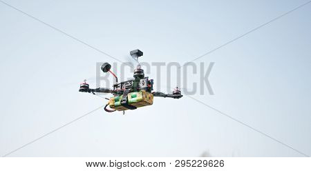 A Small Fpv Racing Drone Is Ready To Fly And Hovered Above The Ground Before The Race. Self-made Fly