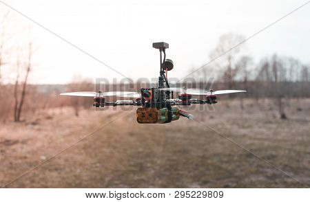A Small Fpv Racing Drone Is Ready To Fly And Hovered Above The Ground Before The Race. Self-made Fly