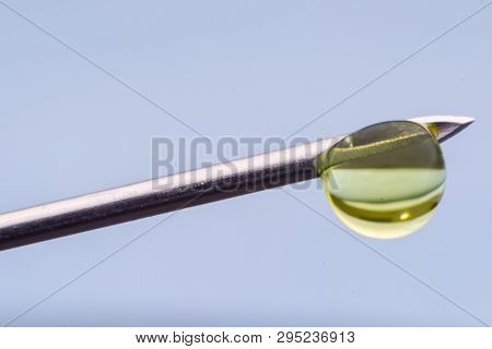 Hypodermic Needle With One Drop Of Drug On His Peak