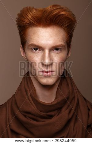 Young Man With Red Hair And Creative Make Up And Hair.