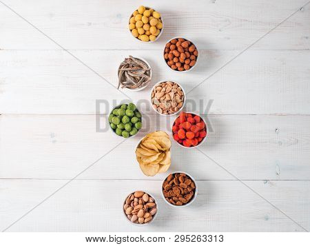 Assortment Of Different Snack For Beer, Wine, Party. Peanuts In Coconut Glaze, Green Vasabi, Red Spi