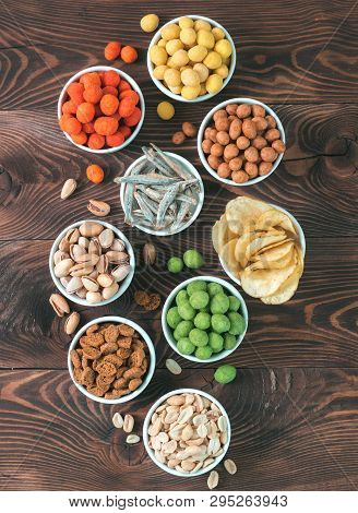 Assortment Of Different Snack For Beer, Wine, Party. Peanuts In Coconut Glaze, Green Vasabi, Red Spi