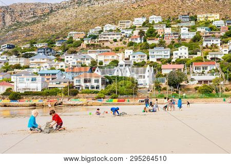 Kids Playing On Fish Hoek Beach On A Cloudy Day