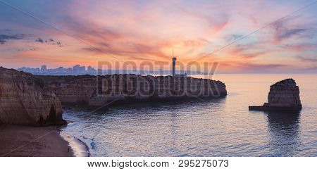 Sea Coast Sunset View With Lighthouse Of Ponta Do Altar. West View Over Praia Da Afurada Beach (ferr