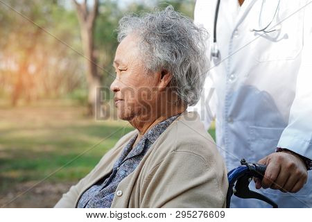 Doctor Help And Care Asian Senior Or Elderly Old Lady Woman Patient Sitting On Wheelchair At Nursing