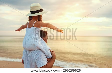 Father's Day. Dad And Child Daughter Playing Together Outdoors On A Summer .